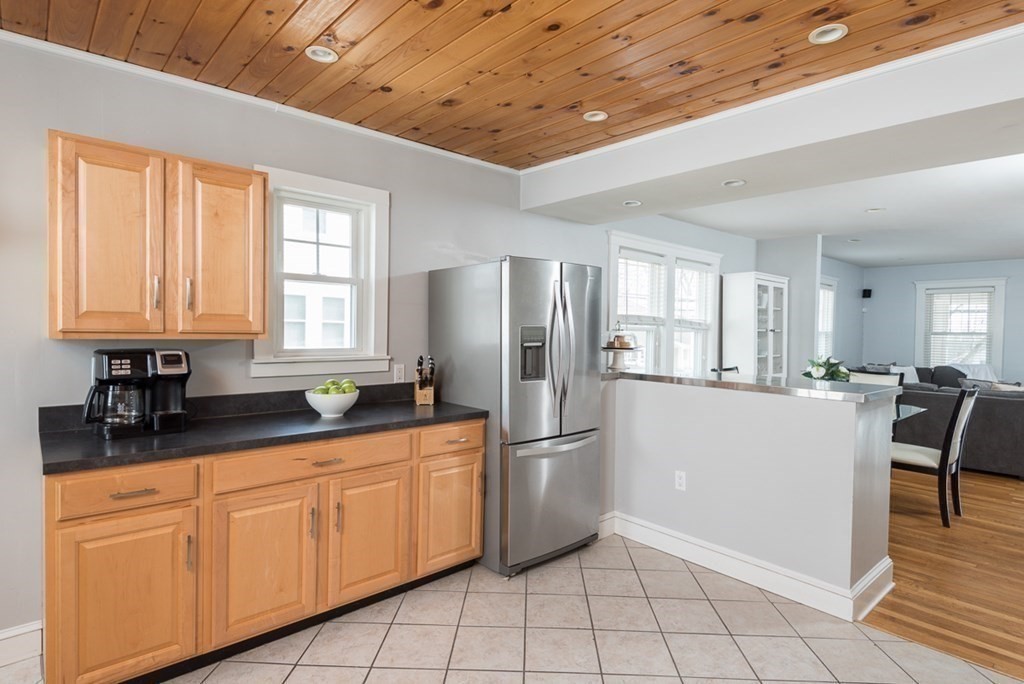 39 Edgemont Road Braintree, MA 02184 - Photo 9 of 39 a kitchen with granite countertop white cabinets and refrigerator