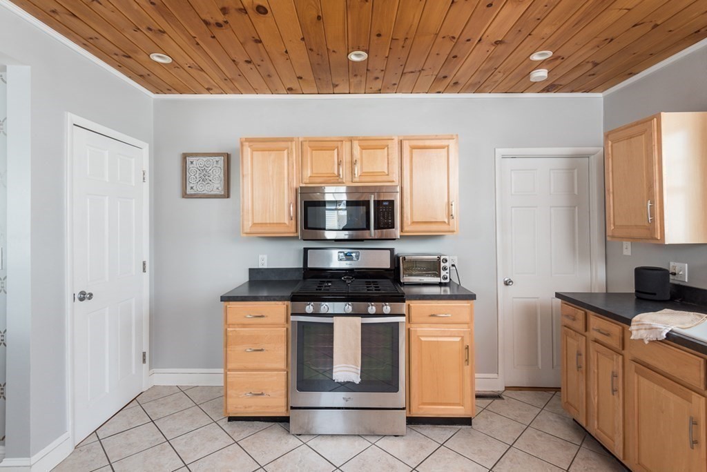 39 Edgemont Road Braintree, MA 02184 - Photo 10 of 39 a kitchen with white cabinets and appliances