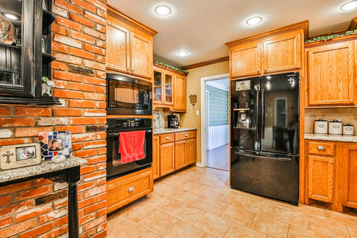 3204 55th Street Lubbock, TX 79413 - Photo 11 of 41 a kitchen with stainless steel appliances granite countertop a refrigerator a stove and a sink
