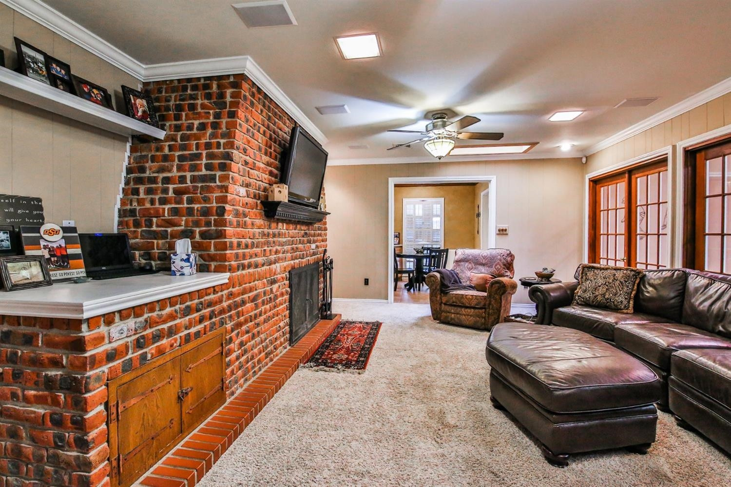 3204 55th Street Lubbock, TX 79413 - Photo 13 of 41 a living room with furniture fireplace and a large window