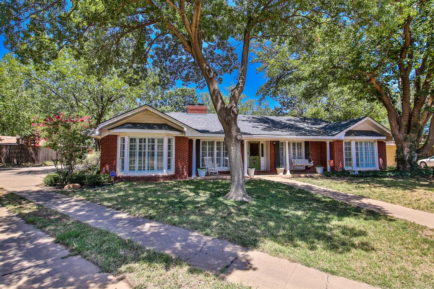 3204 55th Street Lubbock, TX 79413 - Photo 2 of 41 a front view of a house with garden