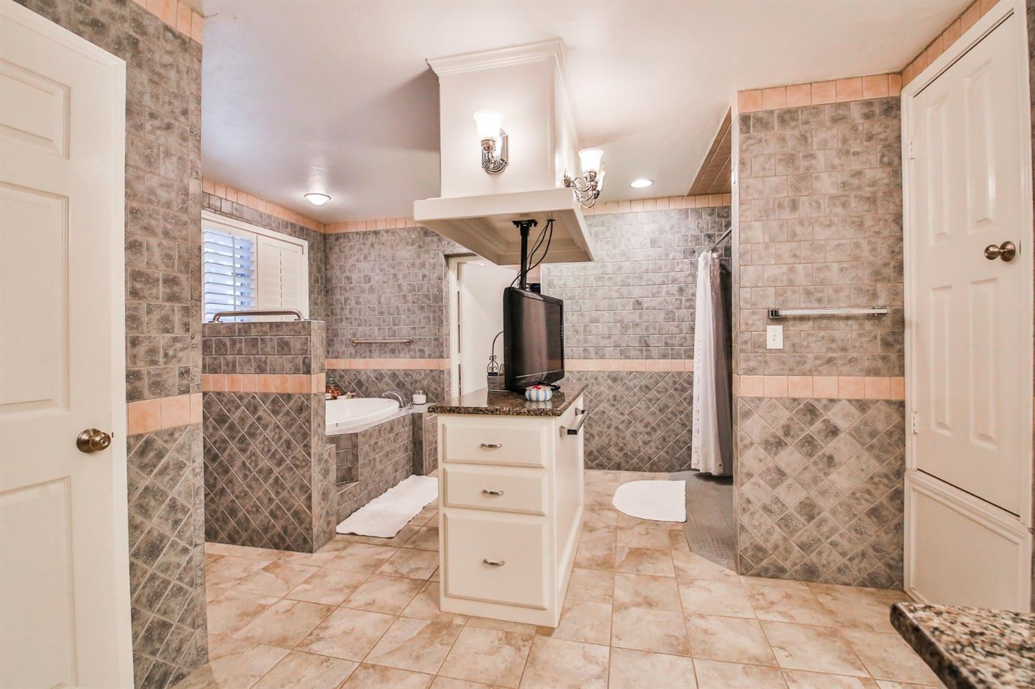 3204 55th Street Lubbock, TX 79413 - Photo 23 of 41 a bathroom with a sink a toilet and shower
