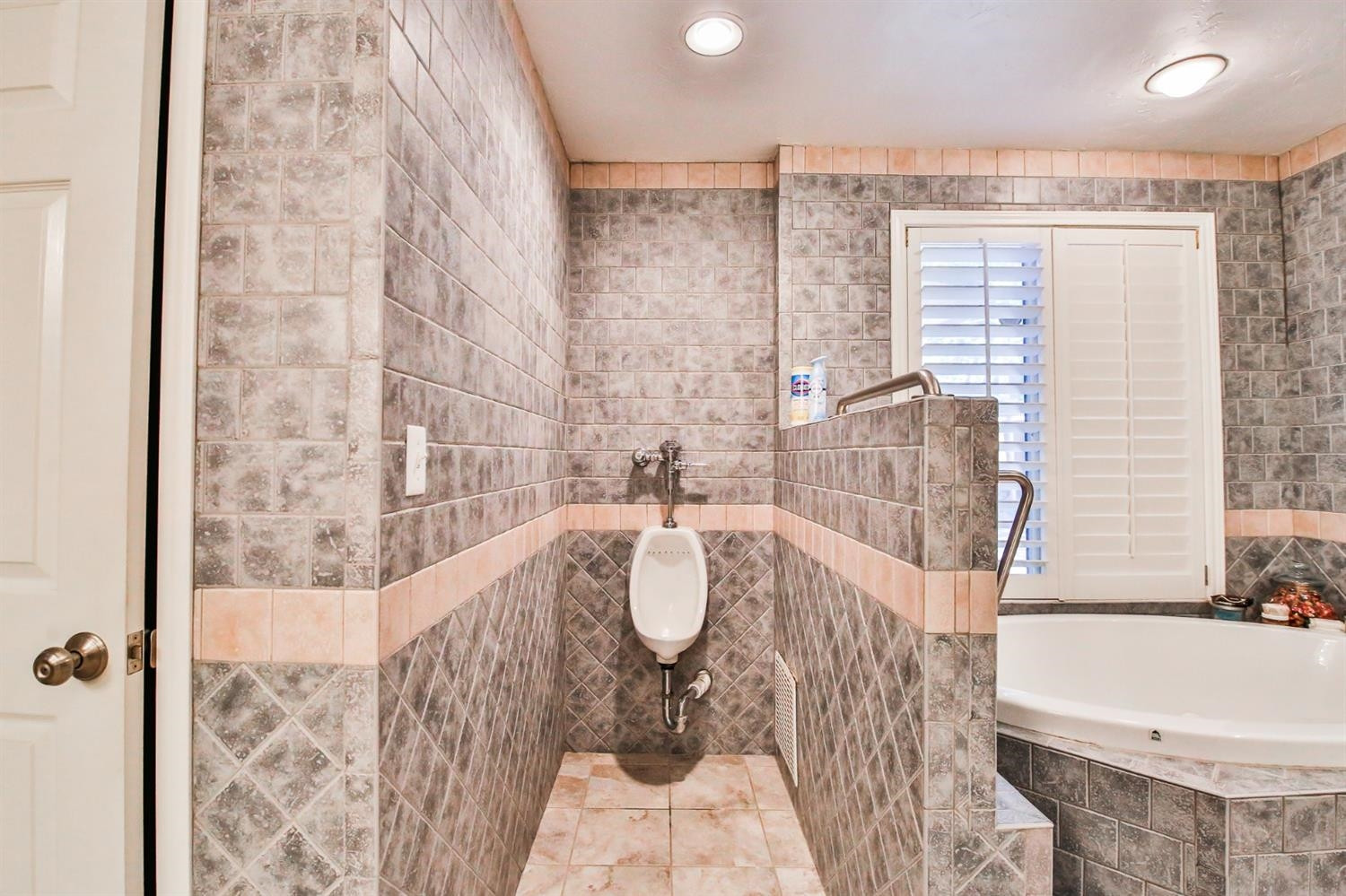 3204 55th Street Lubbock, TX 79413 - Photo 25 of 41 a bath room with a bath tub and shower