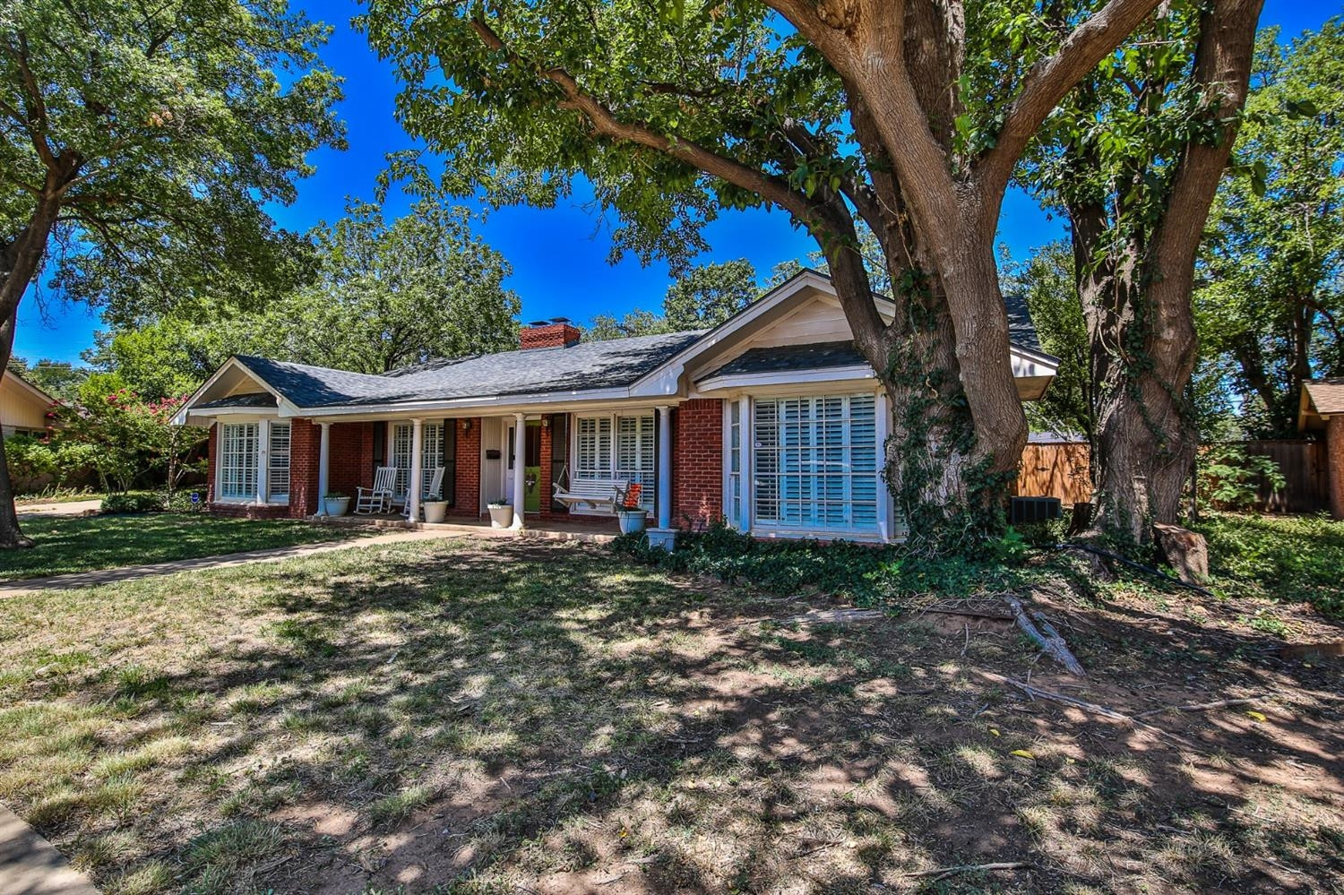 3204 55th Street Lubbock, TX 79413 - Photo 3 of 41 a front view of a house with garden