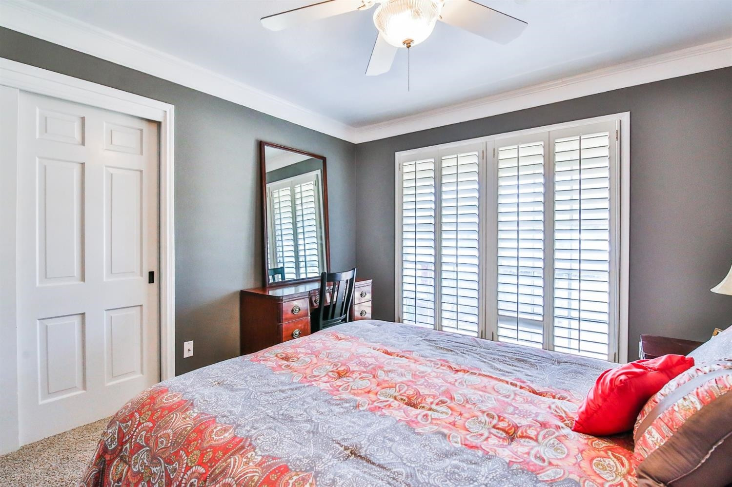 3204 55th Street Lubbock, TX 79413 - Photo 31 of 41 a bedroom with a large bed and a chandelier