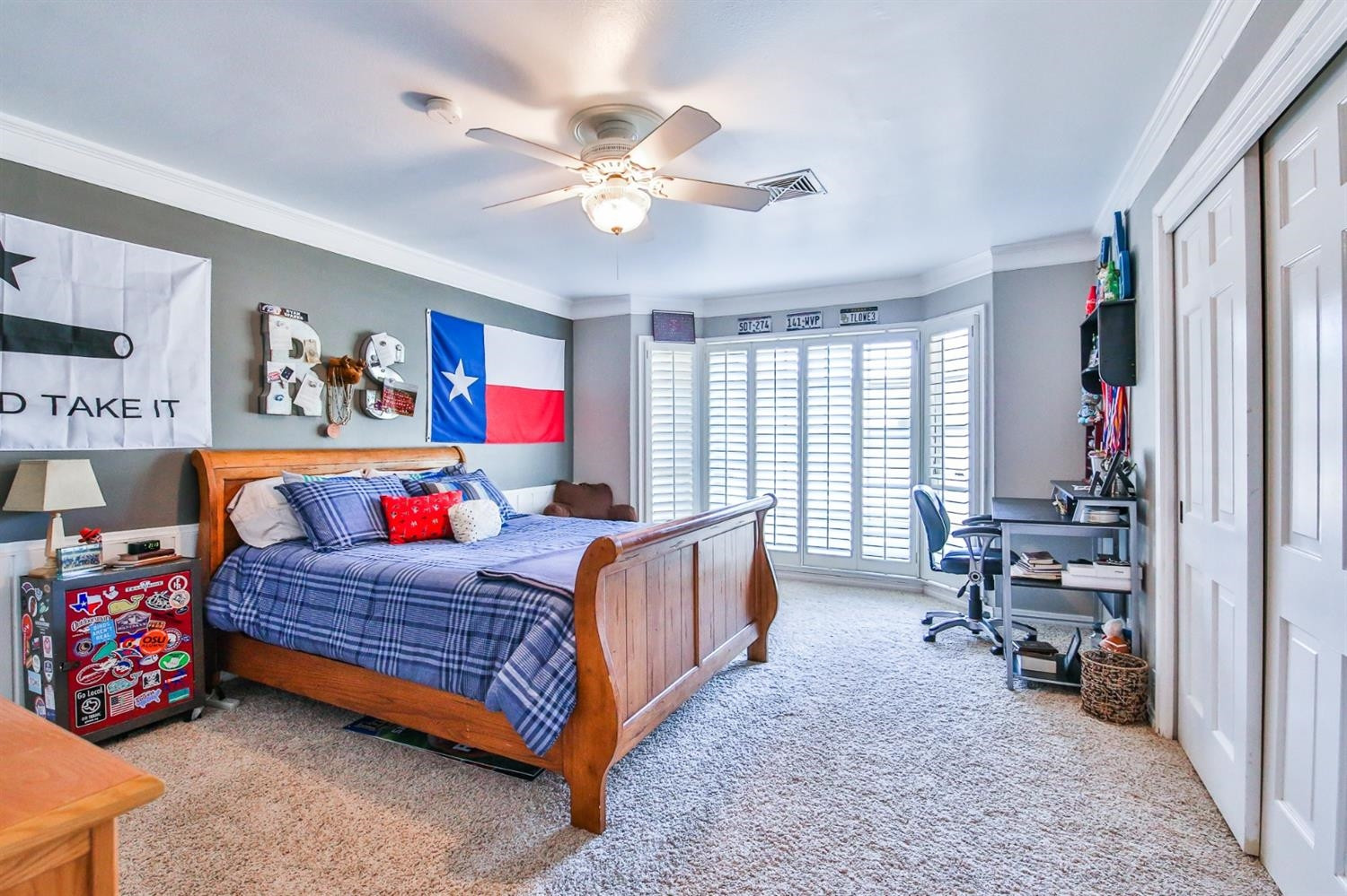 3204 55th Street Lubbock, TX 79413 - Photo 32 of 41 a bedroom with a bed and a chandelier