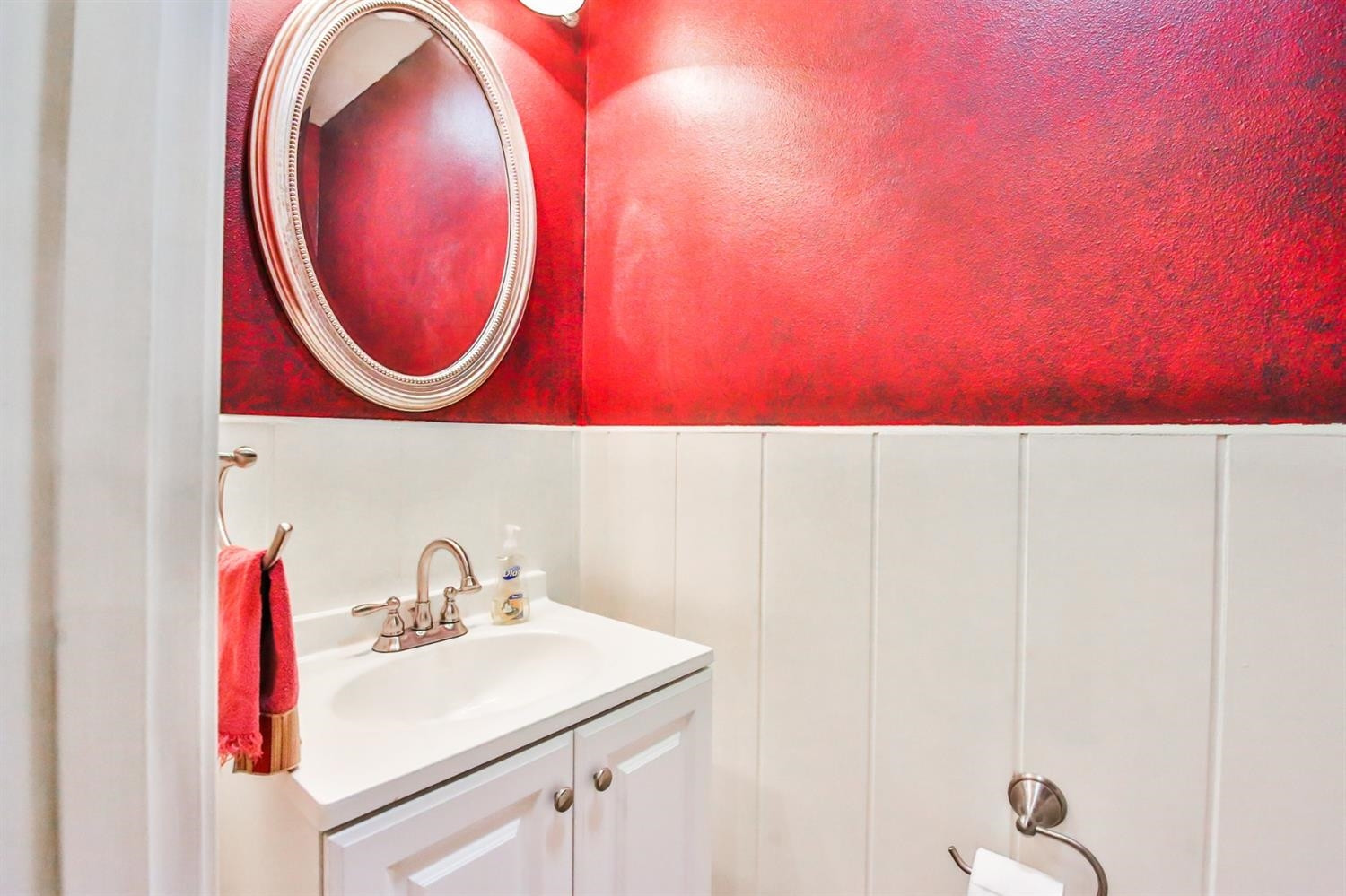 3204 55th Street Lubbock, TX 79413 - Photo 35 of 41 a bathroom with a sink and a mirror