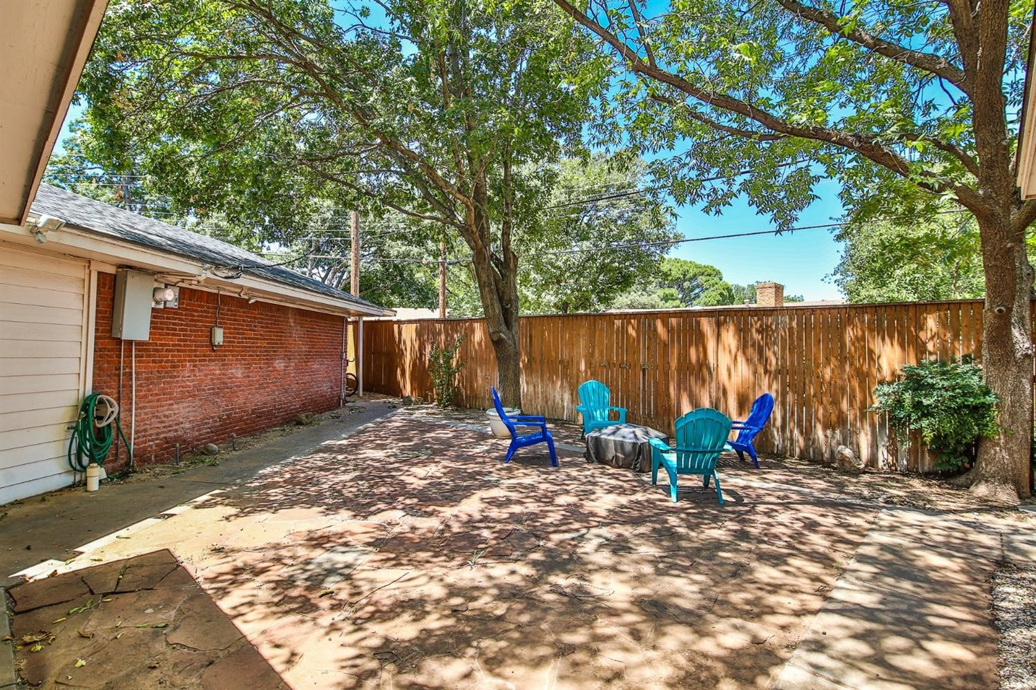 3204 55th Street Lubbock, TX 79413 - Photo 38 of 41 a view of a backyard with chairs and potted plants