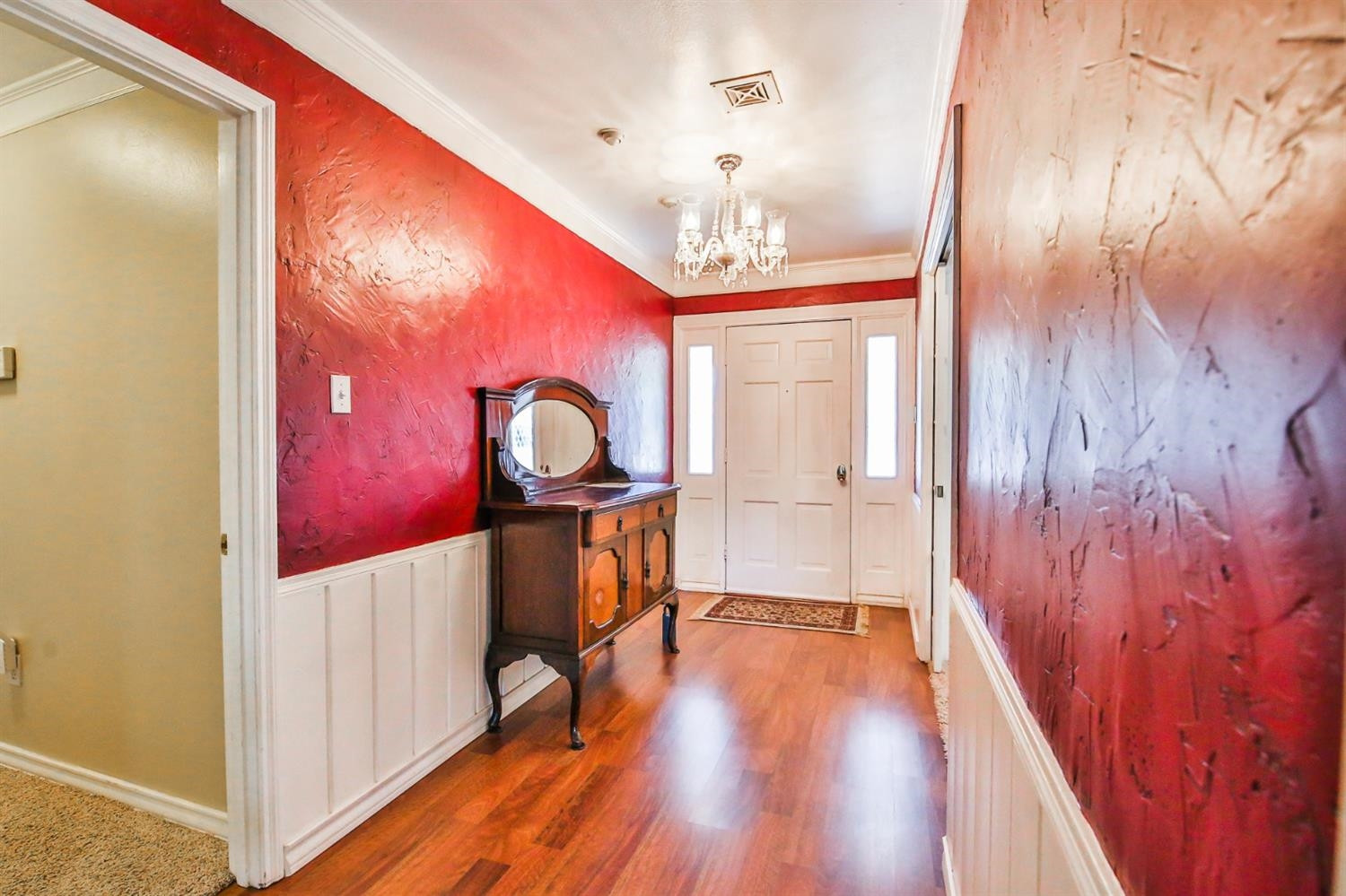 3204 55th Street Lubbock, TX 79413 - Photo 5 of 41 a view of a hallway with wooden floor
