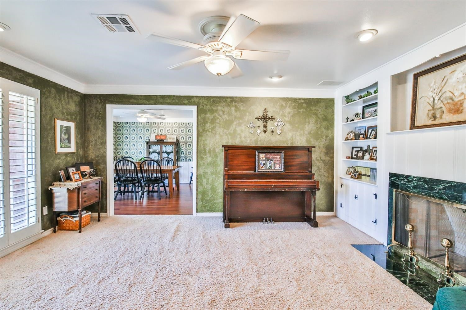 3204 55th Street Lubbock, TX 79413 - Photo 6 of 41 a view of a livingroom with furniture and a flat screen tv