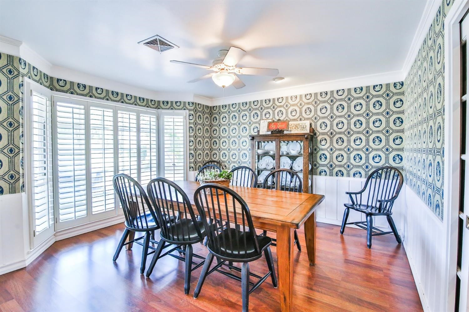 3204 55th Street Lubbock, TX 79413 - Photo 8 of 41 a view of a dining room with furniture and wooden floor