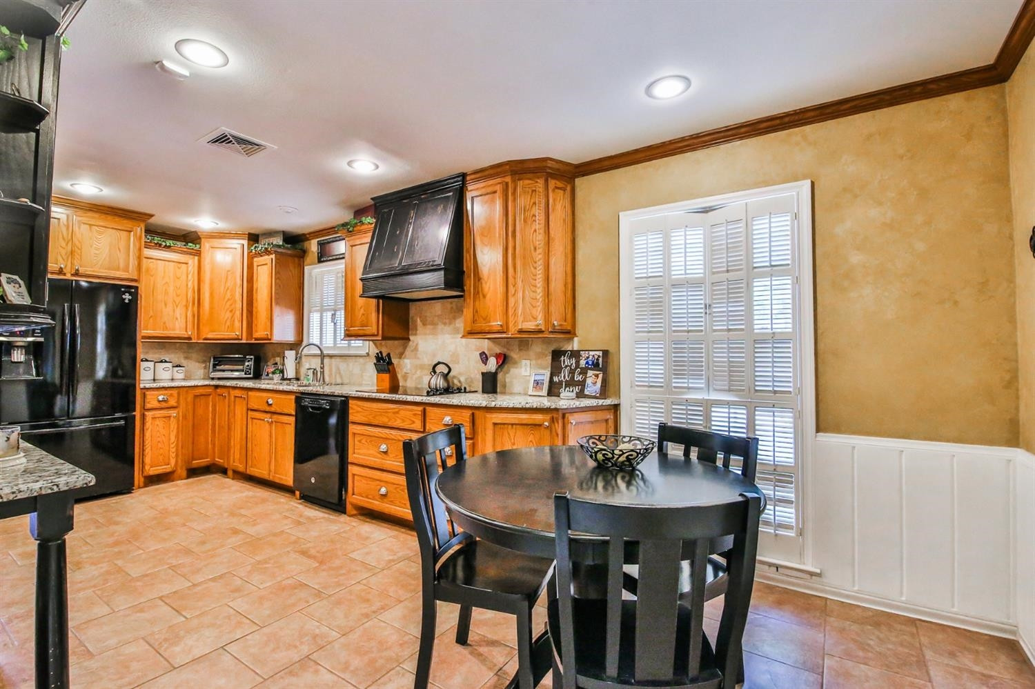 3204 55th Street Lubbock, TX 79413 - Photo 9 of 41 a kitchen with granite countertop a sink counter top space and stainless steel appliances