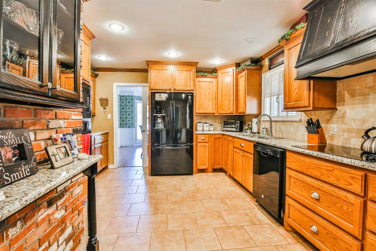 3204 55th Street Lubbock, TX 79413 - Photo 10 of 41 a kitchen with stainless steel appliances a refrigerator and sink