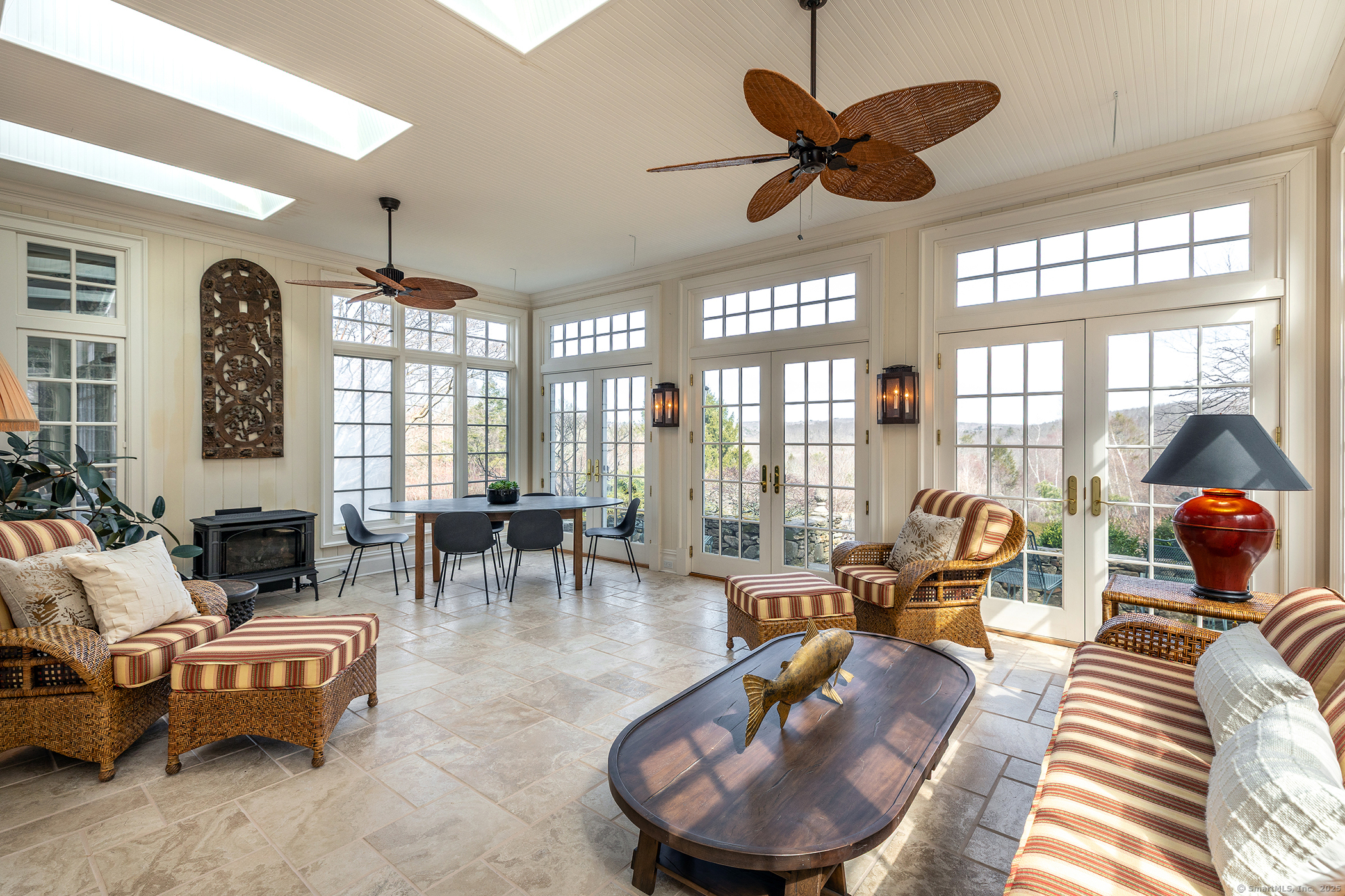 11 Raven Rock Road Roxbury, CT 06783 - Photo 17 of 35 a living room with furniture ceiling fan and a large window