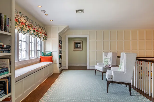 a bedroom with furniture and a window