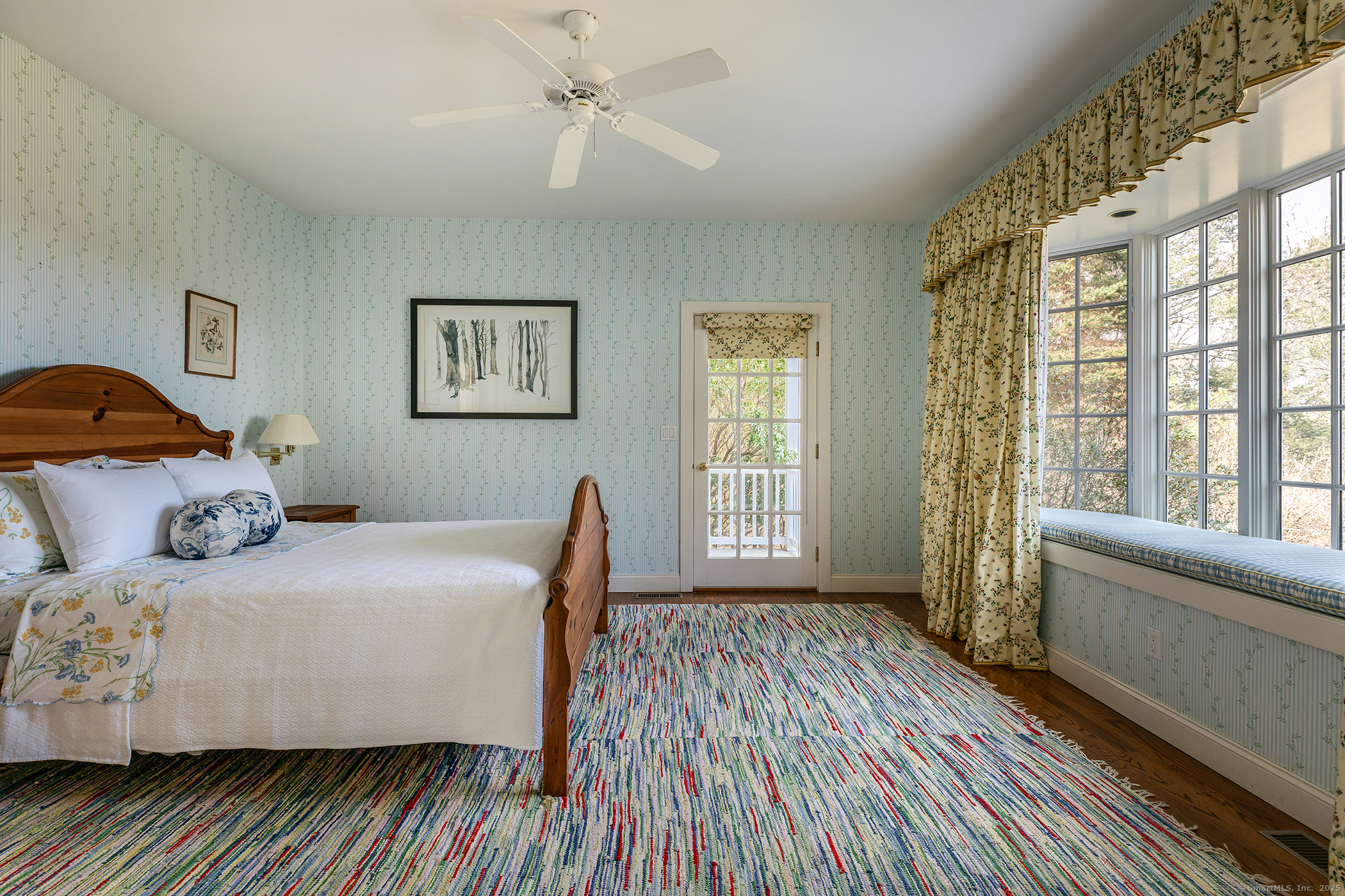 11 Raven Rock Road Roxbury, CT 06783 - Photo 28 of 34 a bedroom with a bed and wooden floor