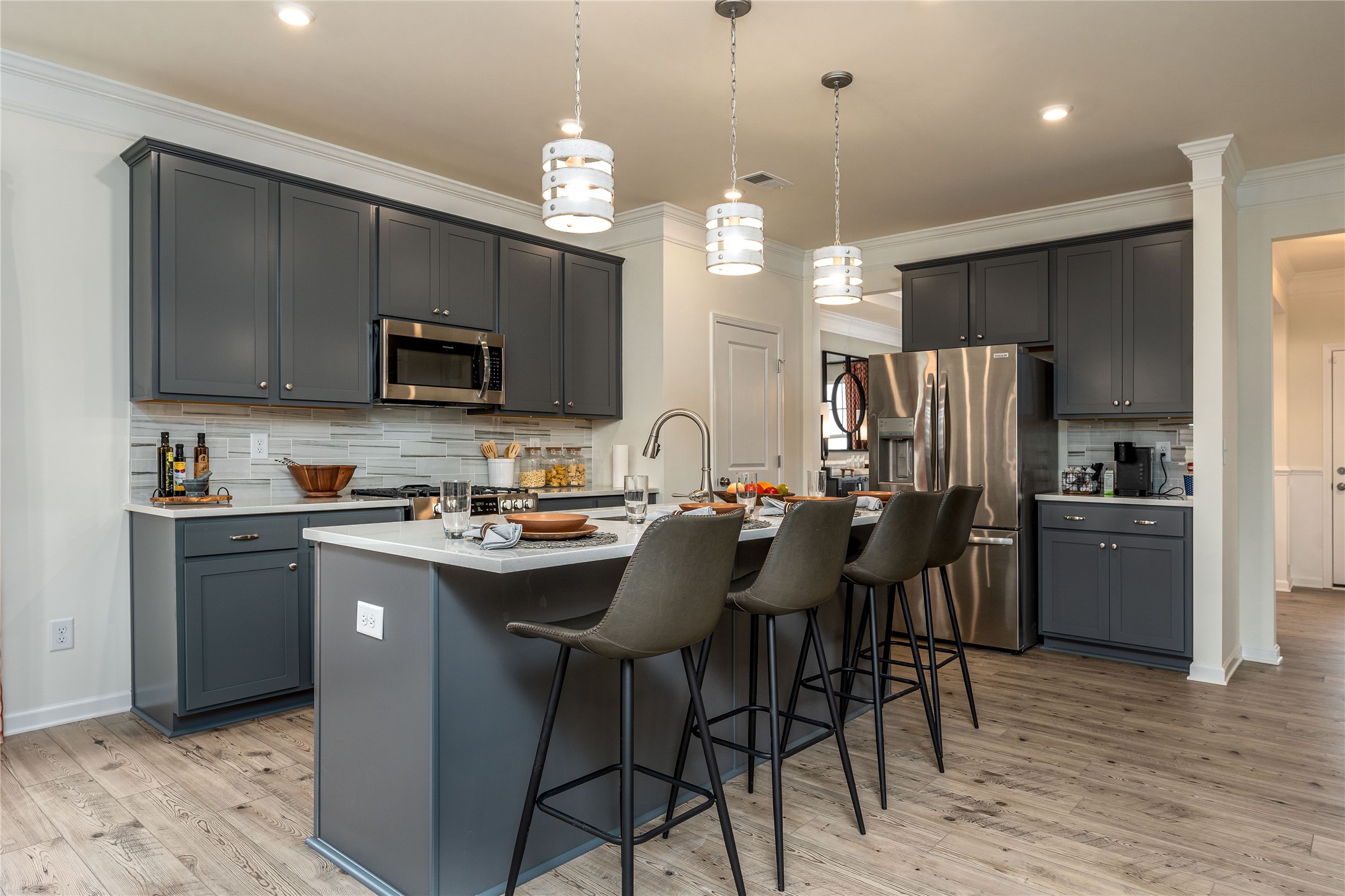 32519 Vly Redstem Way Fulshear, TX 77441 - Photo 4 of 16 The Palmer- Kitchen. The sample image is a staged model, to be used for illustrative purposes only. Upgrades, options, and colors will vary.