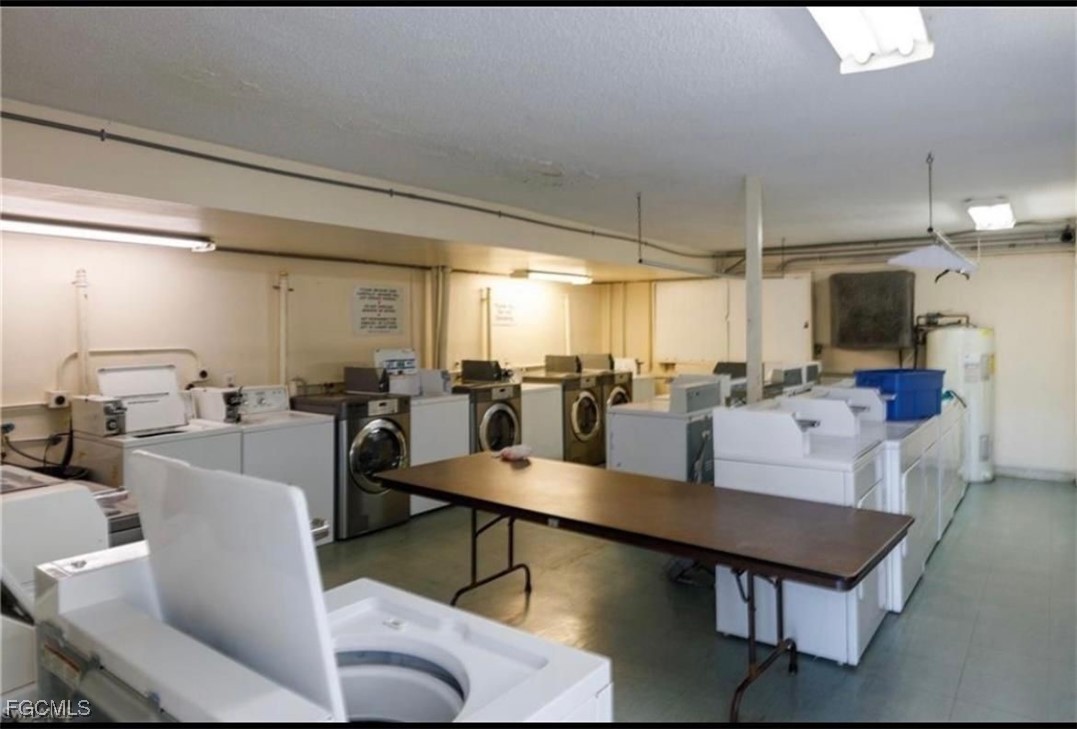 3325 Airport Road North, Unit T6 Naples, FL 34105 - Photo 13 of 13 a living room with lots of furniture and a flat screen tv