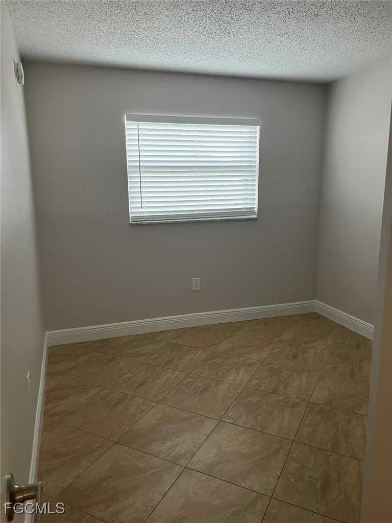 3325 Airport Road North, Unit T6 Naples, FL 34105 - Photo 7 of 13 a view of a window in an empty room