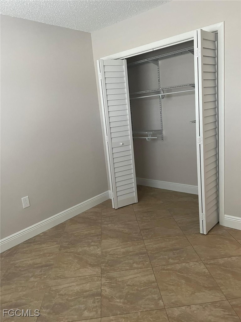 3325 Airport Road North, Unit T6 Naples, FL 34105 - Photo 8 of 13 a view of an empty room with a empty space