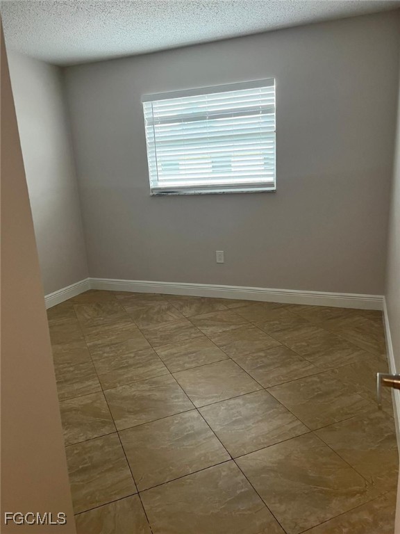 3325 Airport Road North, Unit T6 Naples, FL 34105 - Photo 9 of 13 a view of an empty room with a window