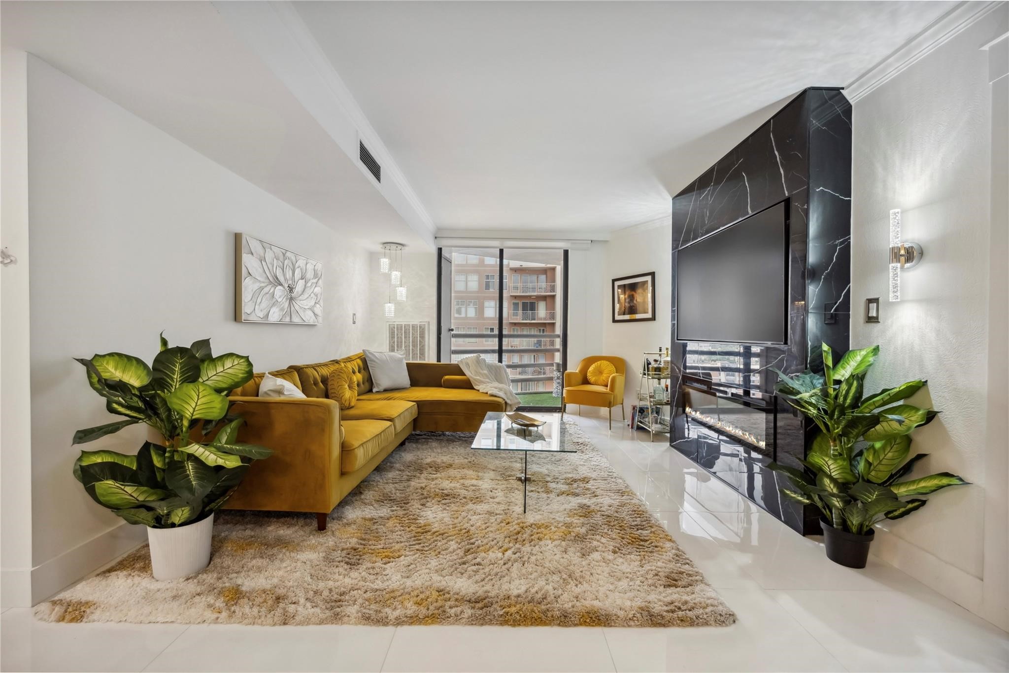 3525 Sage Road, Unit 1713 Houston, TX 77056 - Photo 4 of 25 This modern living room features a sleek design creating a warm and inviting atmosphere.