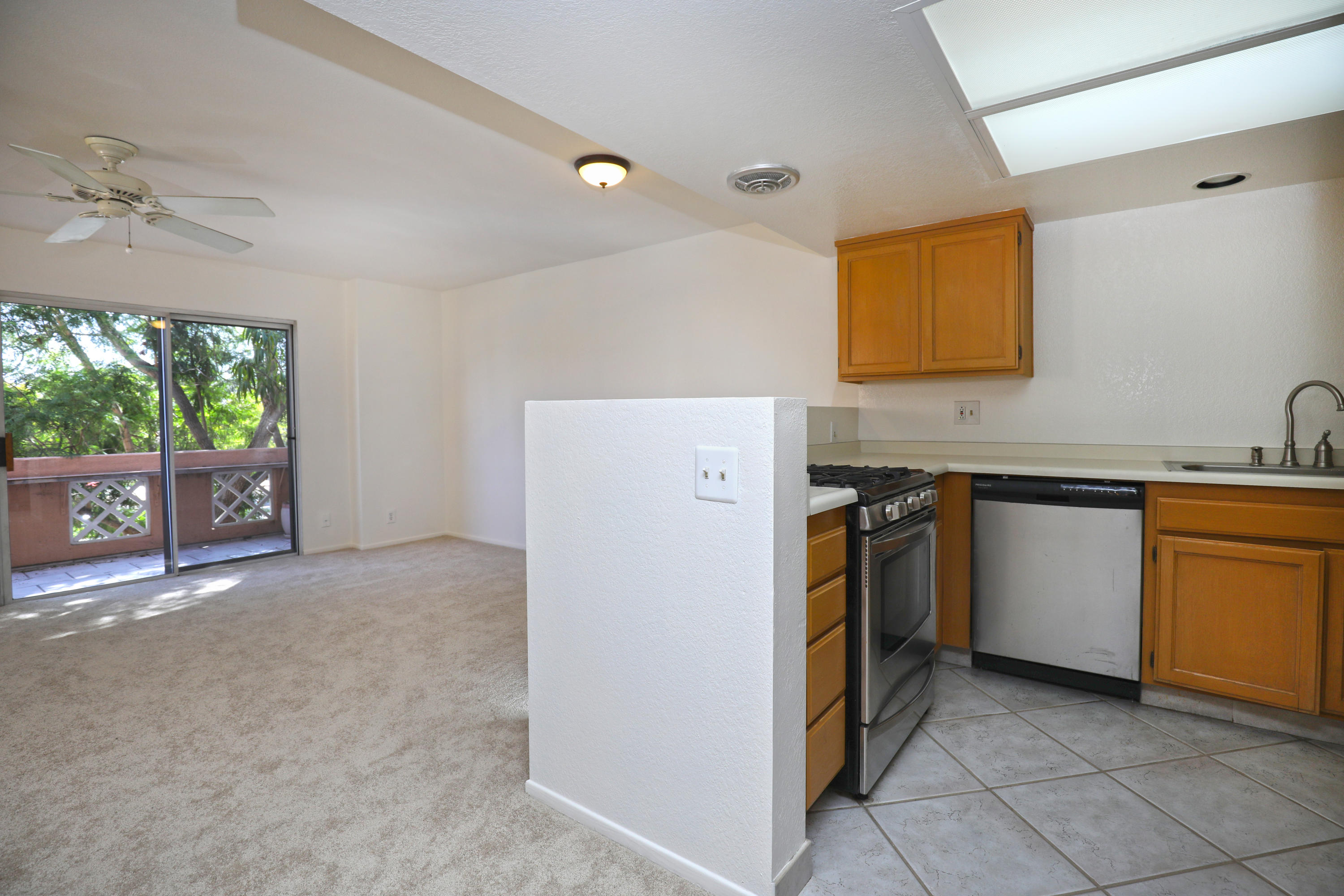 315 Pacific Oaks Road Goleta, CA 93117 - Photo 9 of 20 a view of a kitchen with a sink dishwasher and a refrigerator