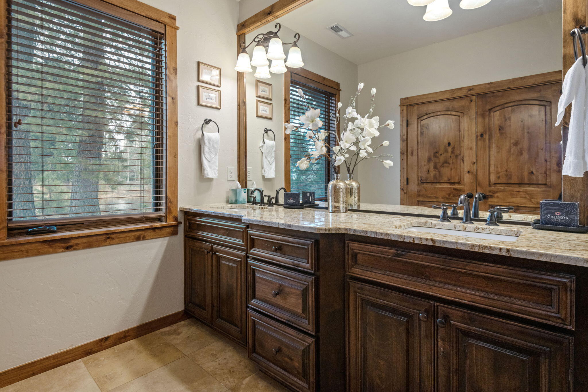 56508 Dancing Rock Loop, Unit 22 Bend, OR 97707 - Photo 35 of 69 a bathroom with a sink double vanity and a mirror