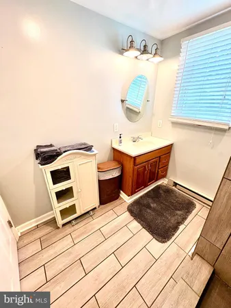 a view of a bathroom with a sink and shower