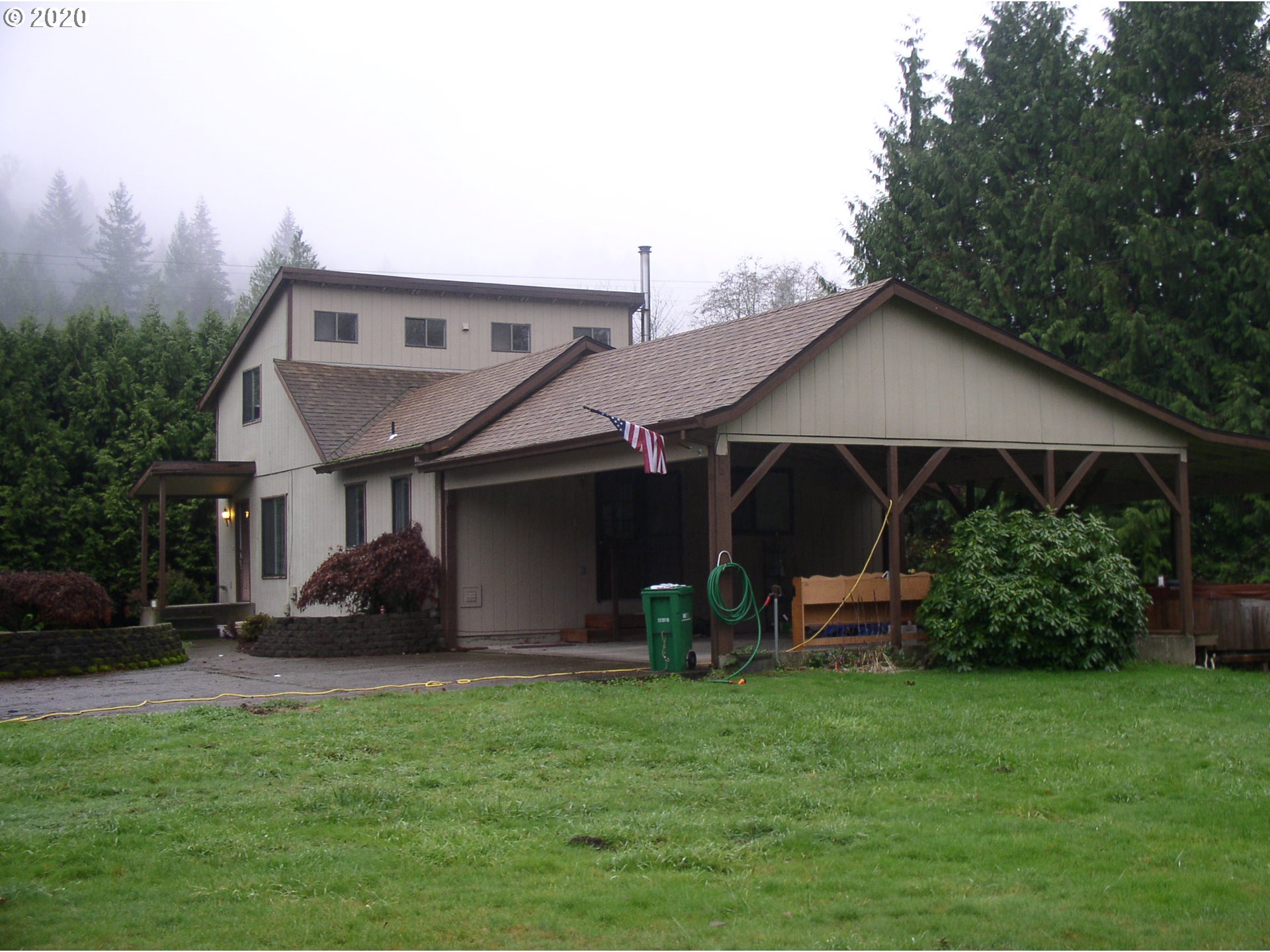 42025 Southeast Coalman Road Sandy, OR 97055 - Photo 1 of 22 a front view of a house with garden