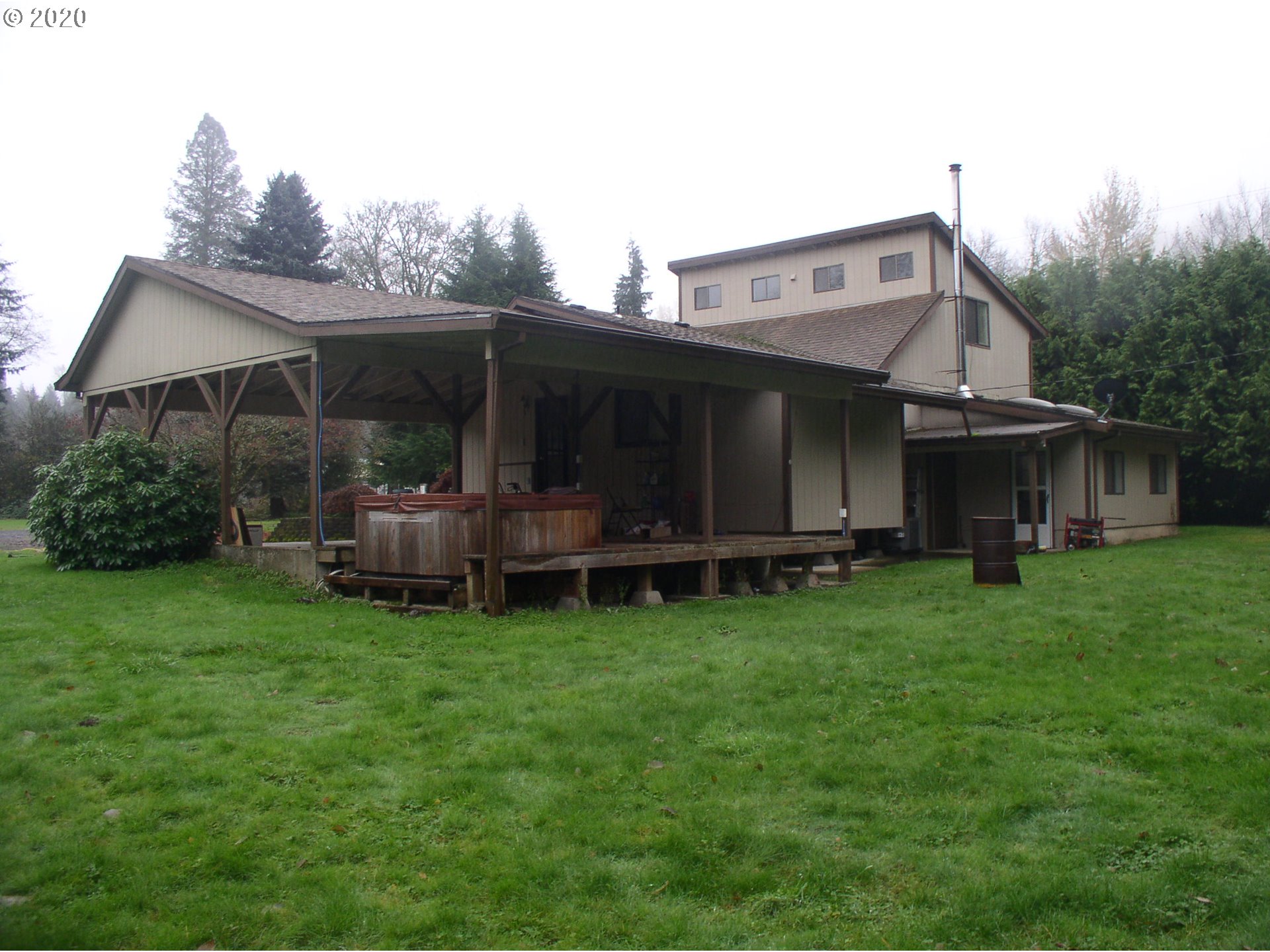 42025 Southeast Coalman Road Sandy, OR 97055 - Photo 2 of 22 a view of a house with backyard and porch