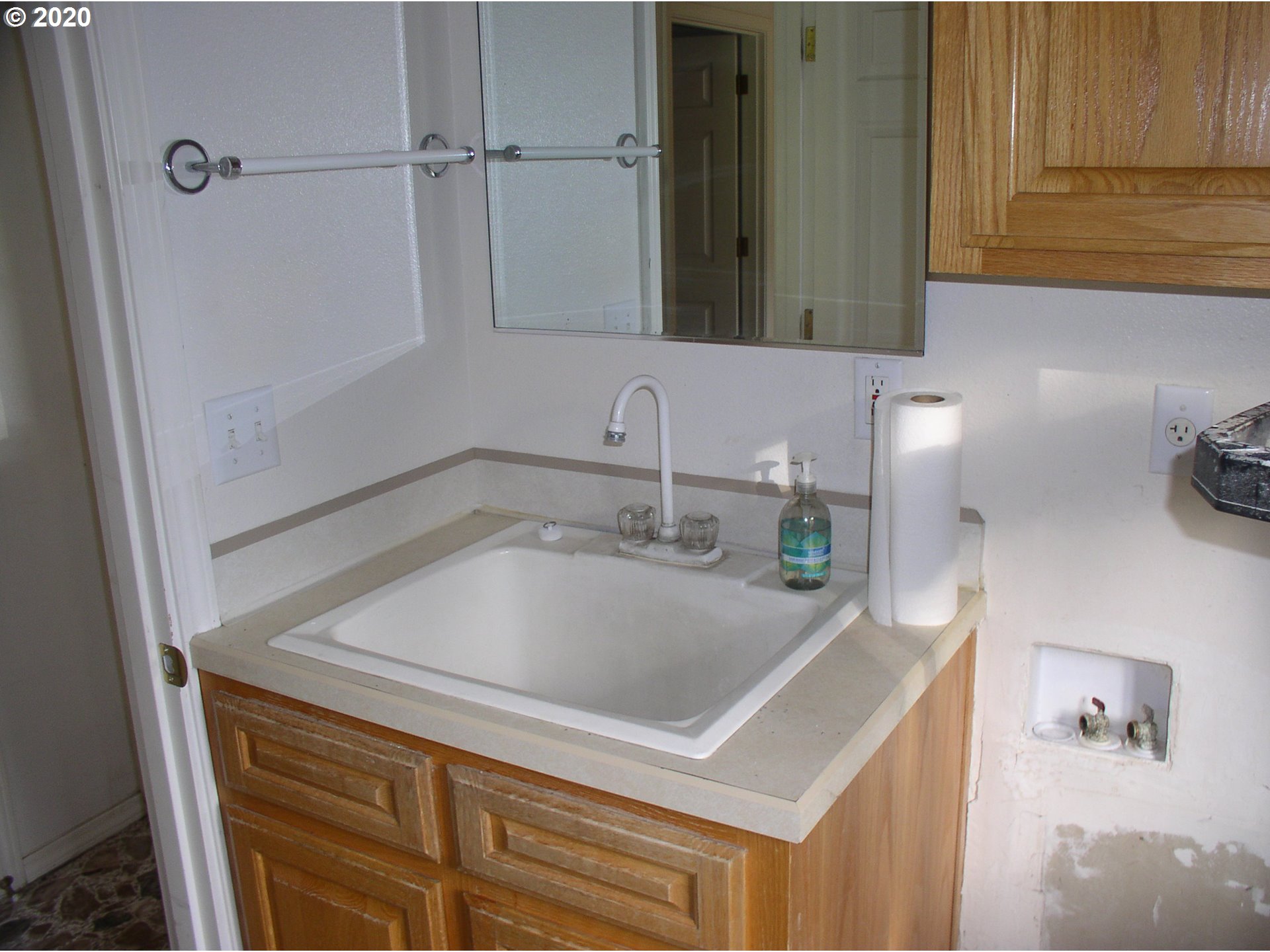 42025 Southeast Coalman Road Sandy, OR 97055 - Photo 22 of 22 a bathroom with a sink and a mirror