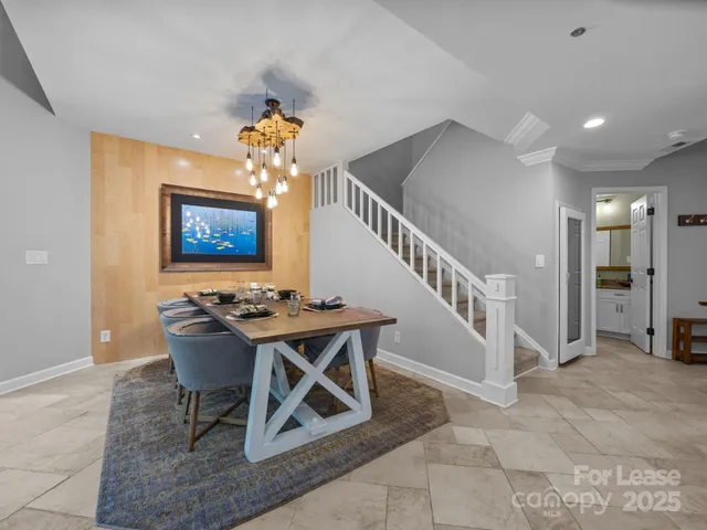 a view of a livingroom with furniture and a workspace