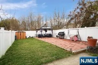 a view of backyard with swimming pool and outdoor seating