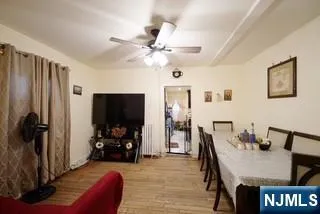 a view of a livingroom with furniture and a flat screen tv