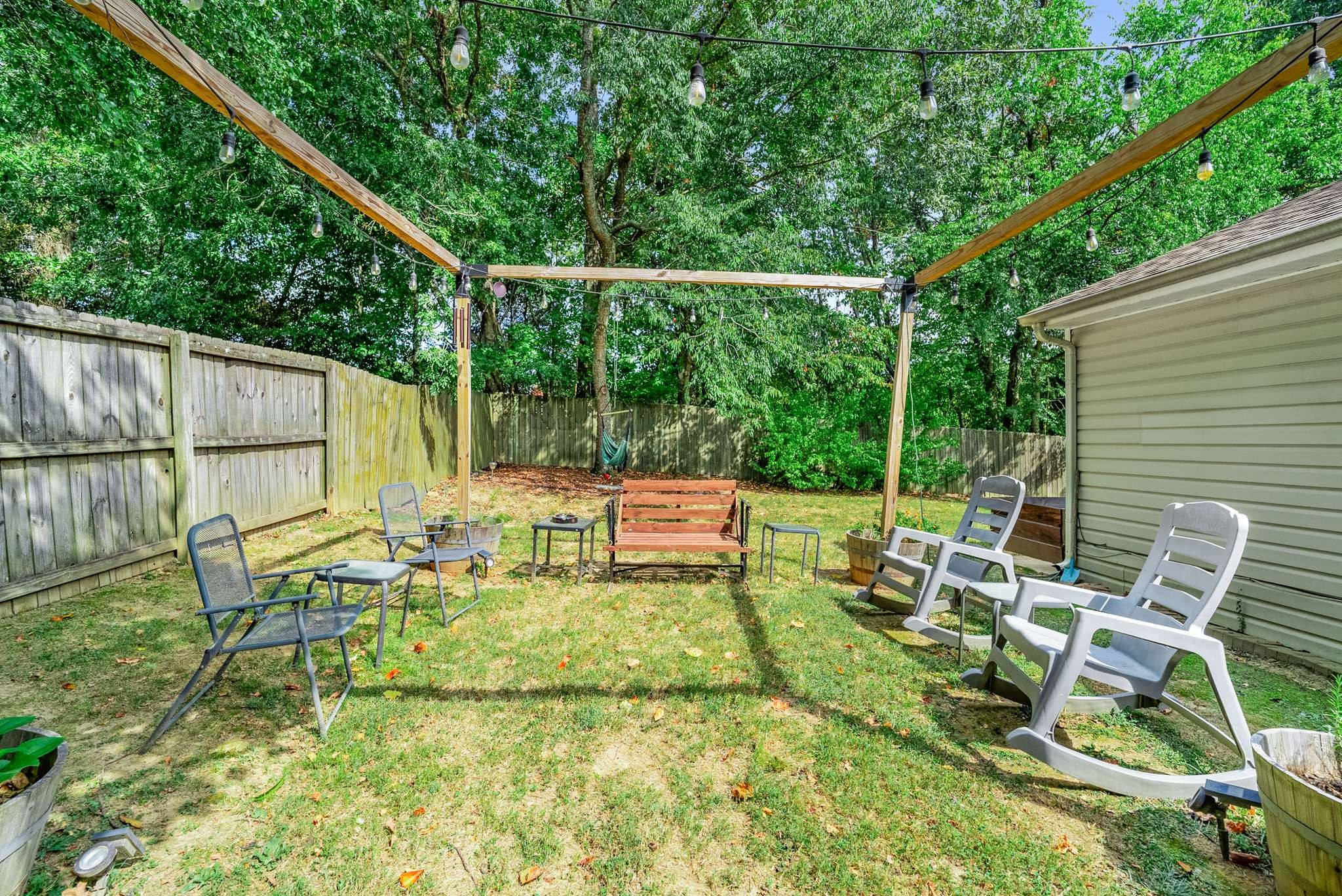 7222 Hidden Lake Drive Fairview, TN 37062 - Photo 20 of 21 a view of backyard with a table and chairs