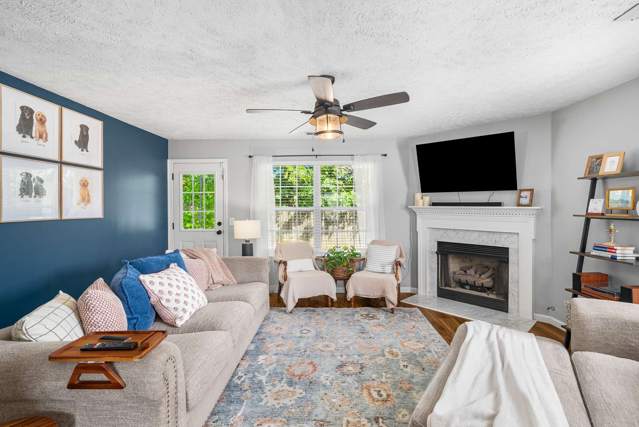 7222 Hidden Lake Drive Fairview, TN 37062 - Photo 4 of 21 a living room with furniture a fireplace and a flat screen tv