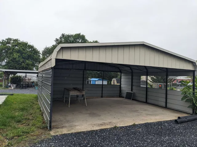 a view of a house with backyard and sitting area