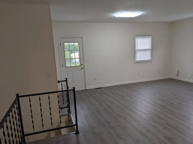 a view of entryway with wooden floor