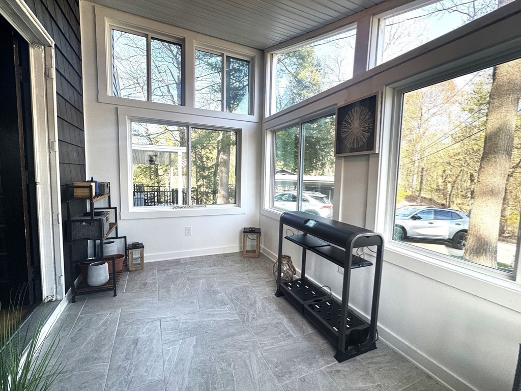 153 Off Pond Street Dunstable, MA 01827 - Photo 19 of 35 a living room with furniture and large windows