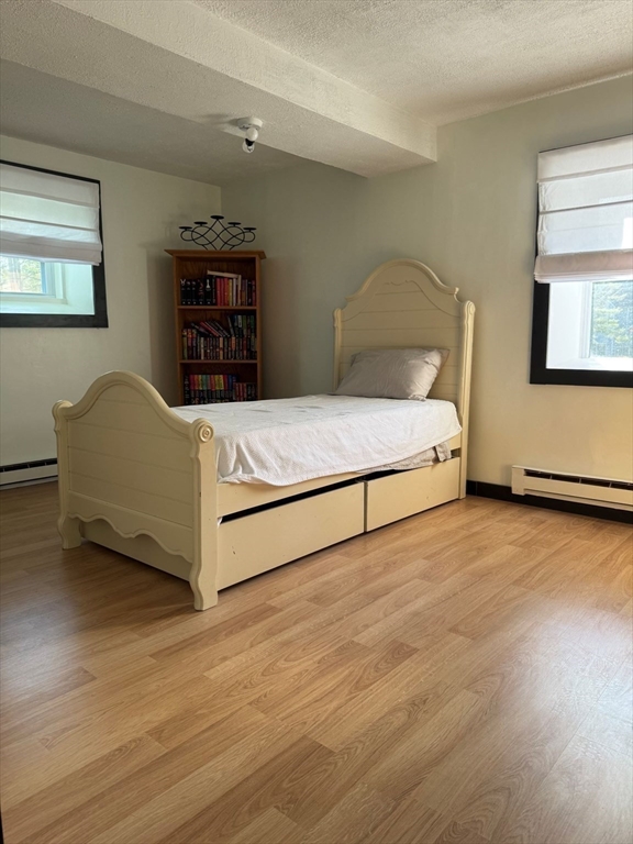 153 Off Pond Street Dunstable, MA 01827 - Photo 27 of 35 a bedroom with a bed and a dresser