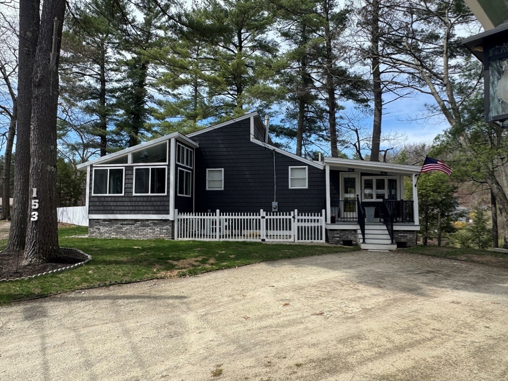 153 Off Pond Street Dunstable, MA 01827 - Photo 29 of 35 a view of a house with a yard and sitting area