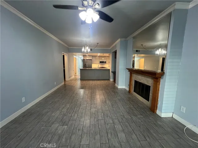 wooden floor in an empty room with a fireplace