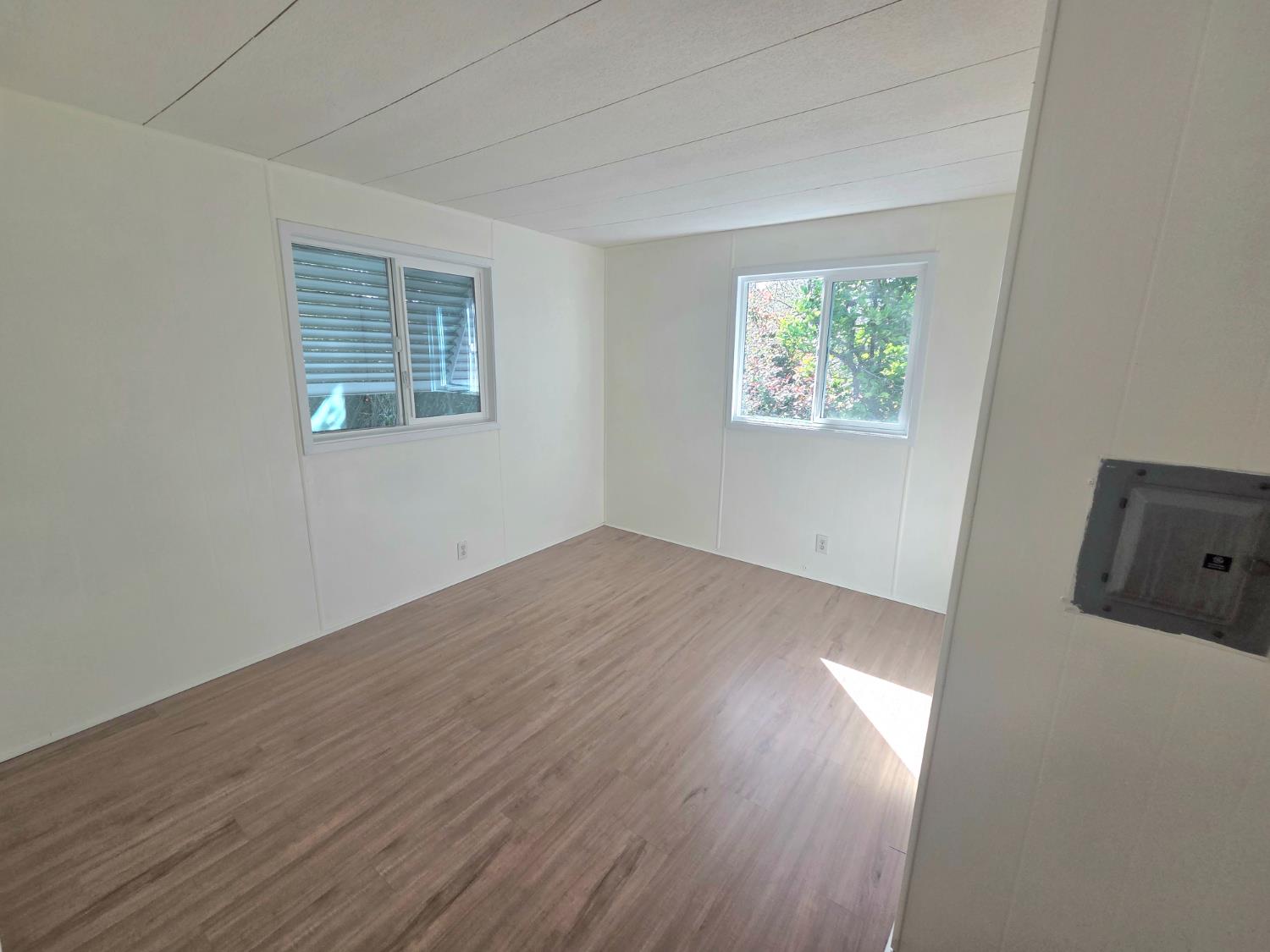 5200 Cavitt Stallman Road, Unit 35 Granite Bay, CA 95746 - Photo 16 of 31 an empty room with wooden floor and windows