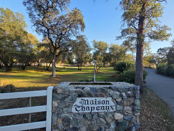 a living room with furniture a window and a table