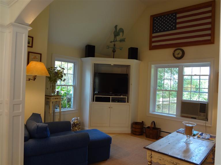 61 Clamshell Cove Road Cotuit, MA 02635 - Photo 4 of 12 a living room with furniture and a flat screen tv