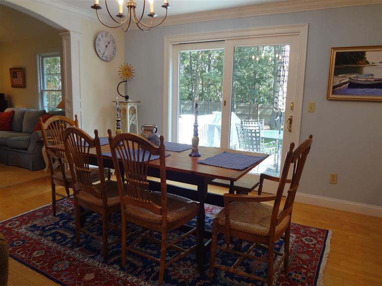 61 Clamshell Cove Road Cotuit, MA 02635 - Photo 5 of 12 a view of a dining room with furniture window and wooden floor