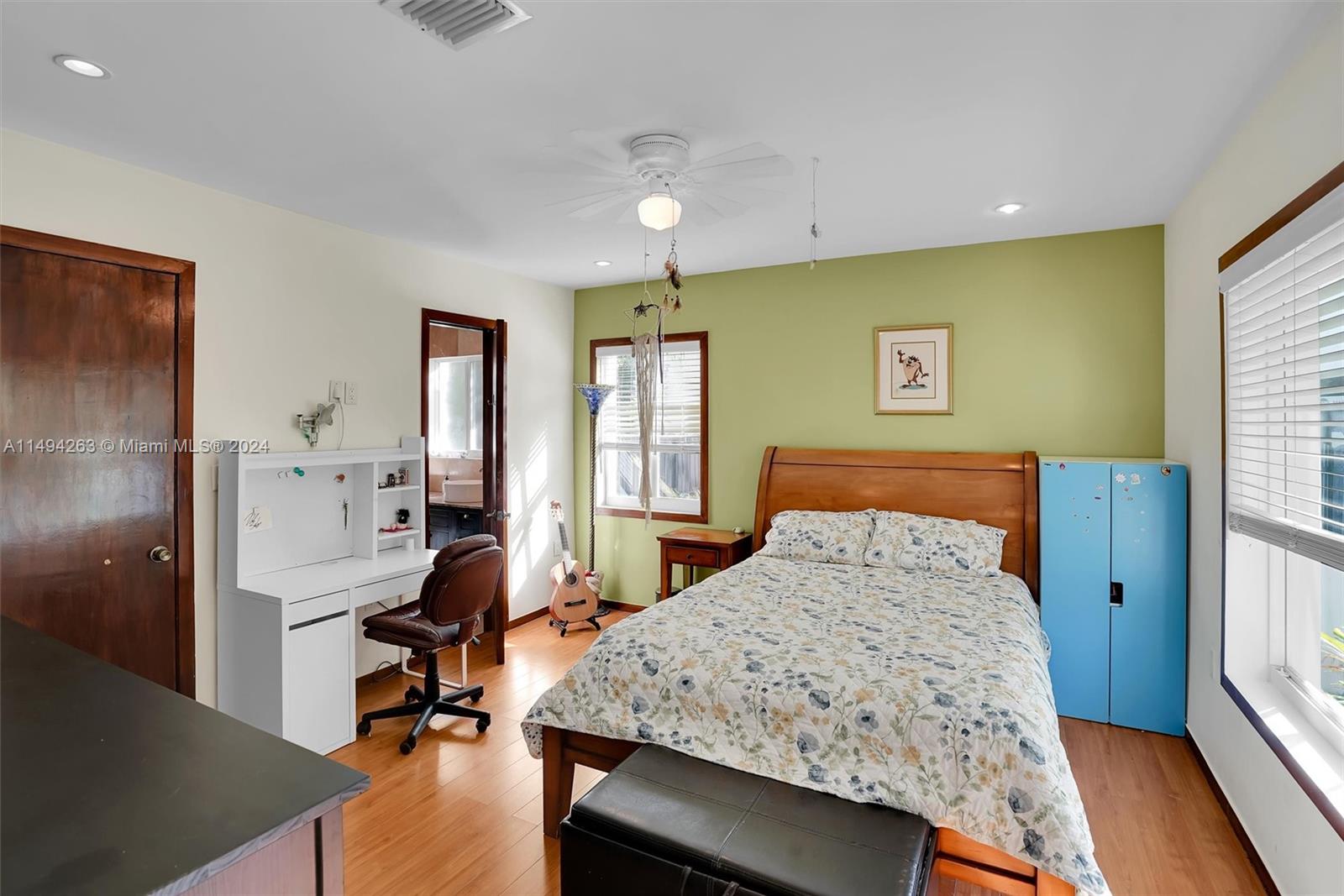 4331 Alton Road Miami Beach, FL 33140 - Photo 17 of 33 a bedroom with a bed and a table in it