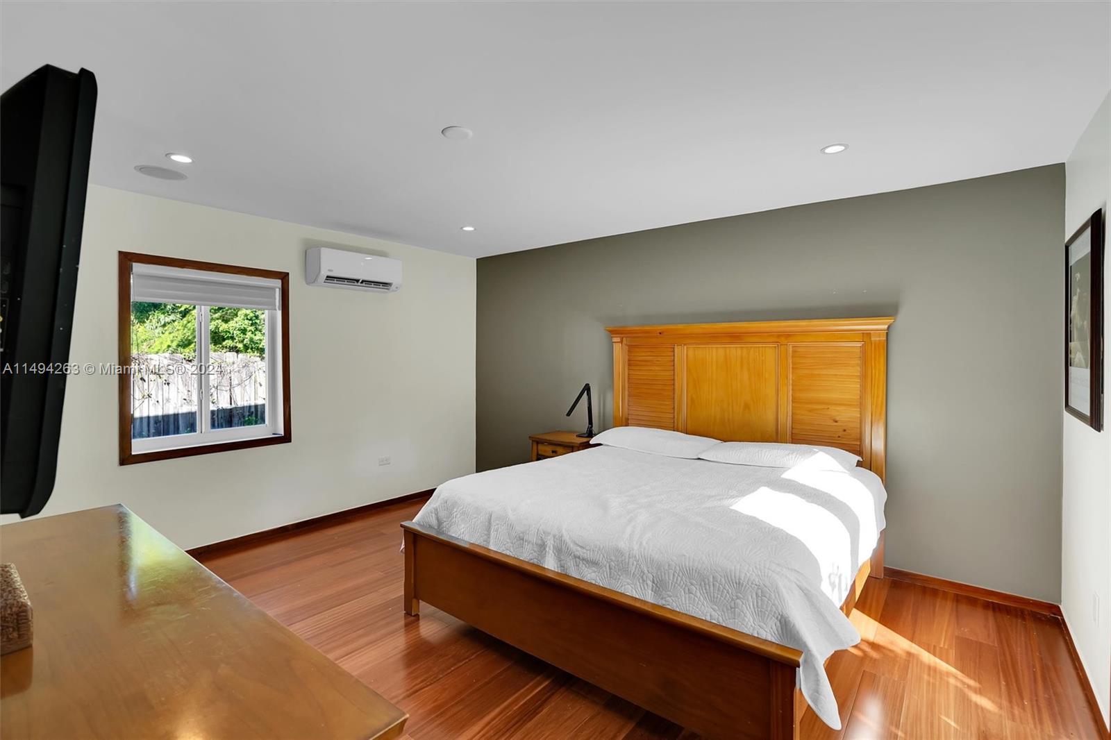 4331 Alton Road Miami Beach, FL 33140 - Photo 26 of 33 a bedroom with a bed and a window