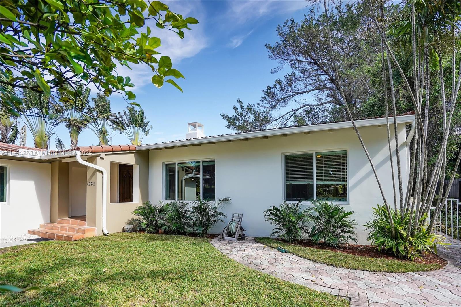 4331 Alton Road Miami Beach, FL 33140 - Photo 3 of 33 a view of a house with a yard